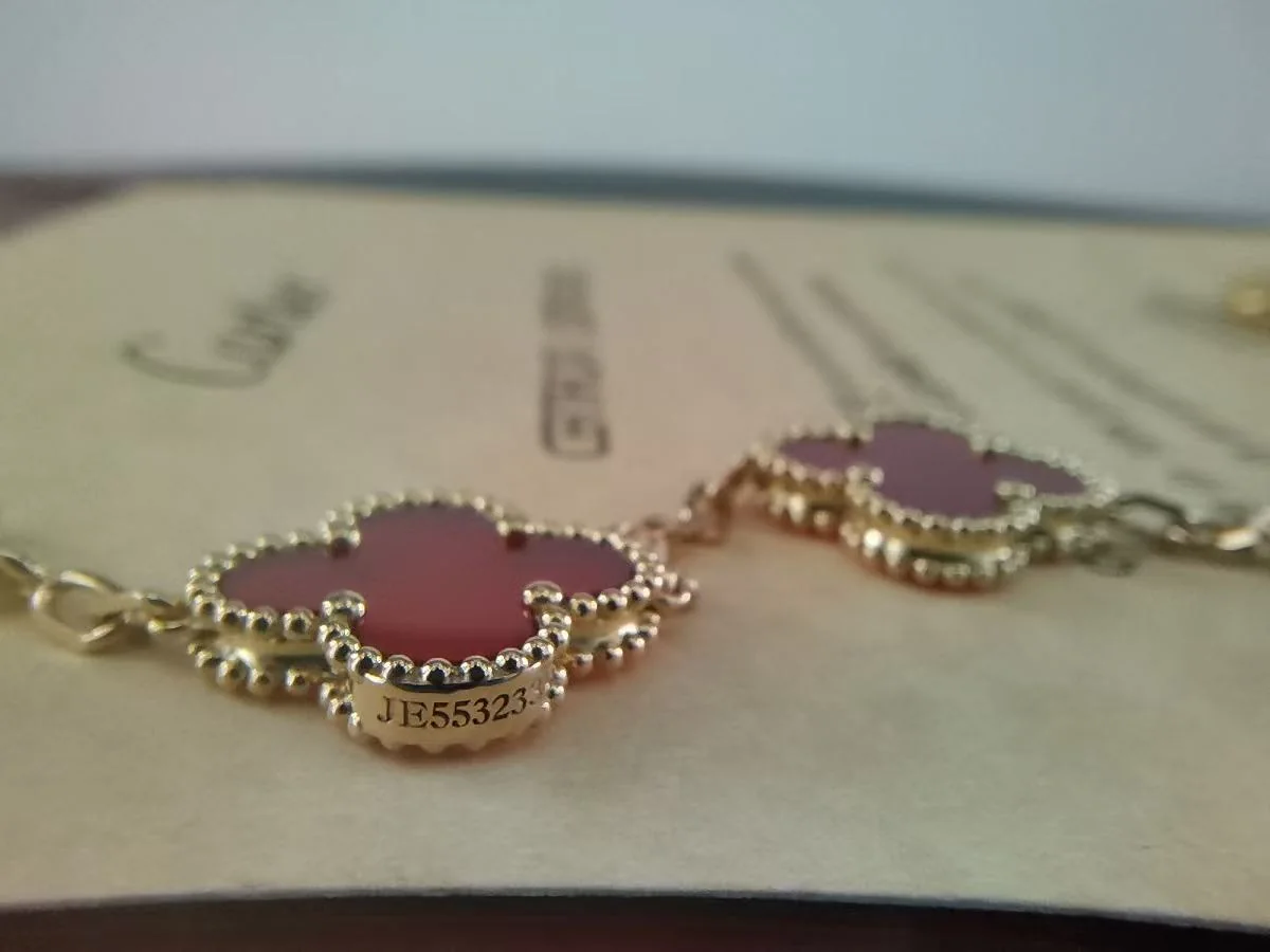 Side profile of a premium carnelian motif showing the gold frame and stone setting