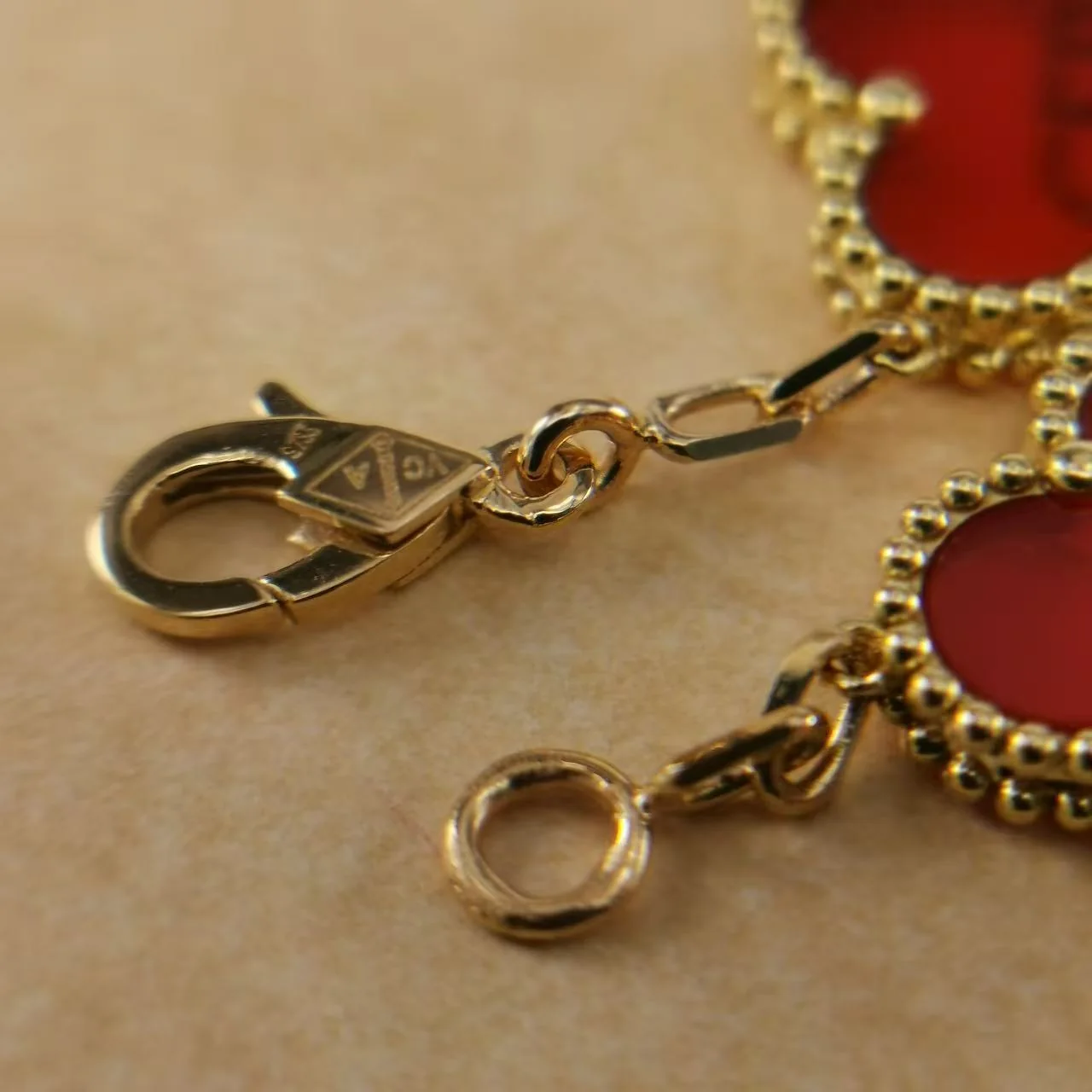 Close-up of the clasp and hallmark details on a Vintage Alhambra-style bracelet
