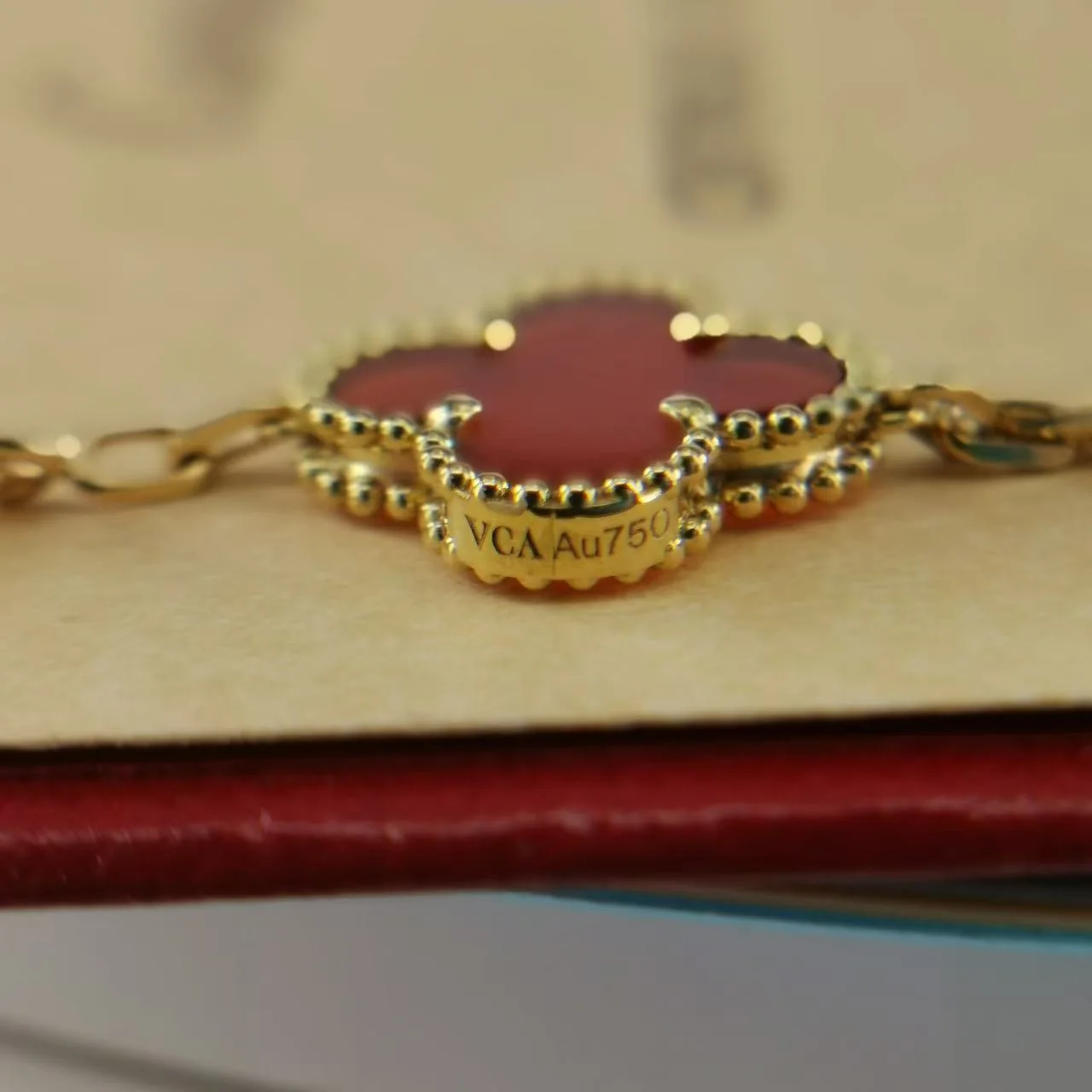 Close-up side view of motif engraving on a Vintage Alhambra-style bracelet