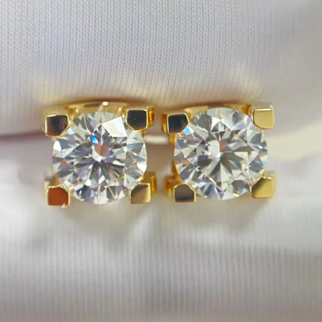 Close-up of the yellow gold settings on the diamond stud earrings