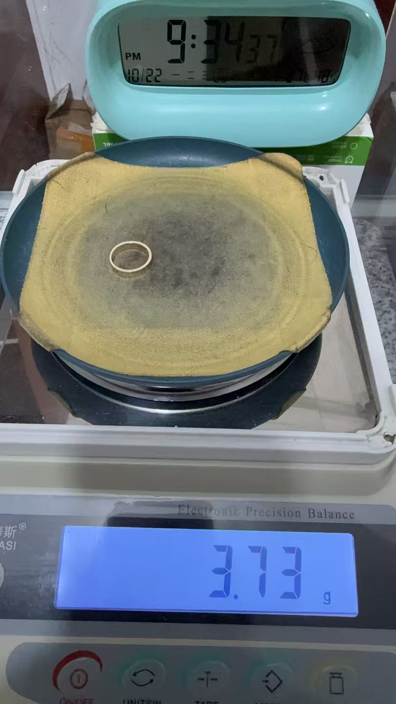 Supplied photograph of a ring on an electronic balance displaying 3.73 g