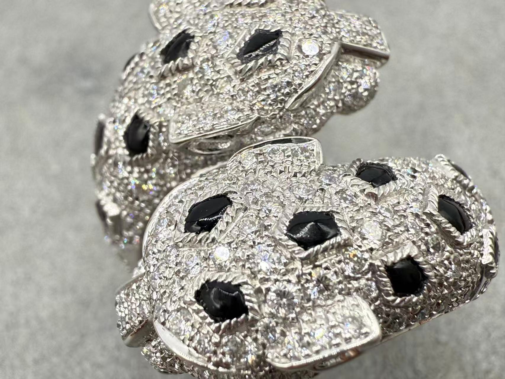 Close-up of the replica panther ring showing dark spots among clear-looking decorative stones