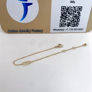 Move Uno style mini bracelet displayed in front of the Justes logo and QR code sign